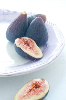 Group of colored figs on the colorful background