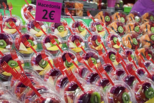 Fresh fruit salad in plastic cups on a Barcelona market