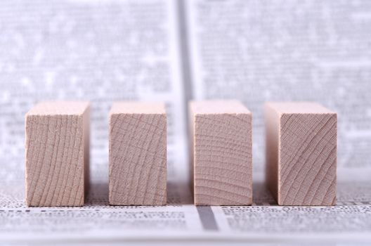 Four wooden blocks you can put your text on.