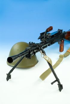Old Russian machine gun and metal army helmet