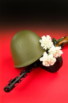Old Russian machine gun and flowers