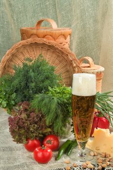 Still life with sausage, beer and vegetables