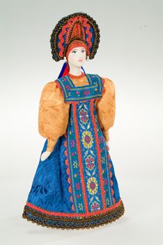 Old Russian traditional folk doll on a studio background