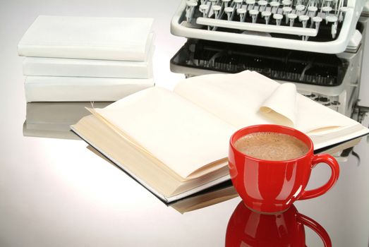 Cup of coffee an old typewriter on a glass background