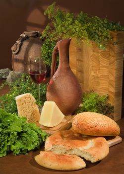 Still life with bread and ceramic jar