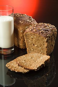 Bread and milk on a black studio background
