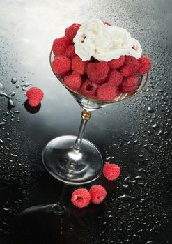 Glass with raspberries and cream