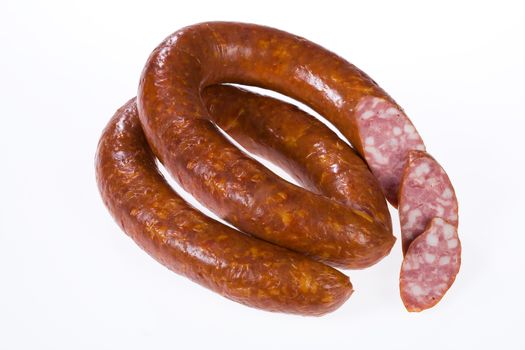 Piece of sausage on isolated background