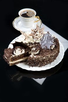 Coffee and chocolate cake on a glass background