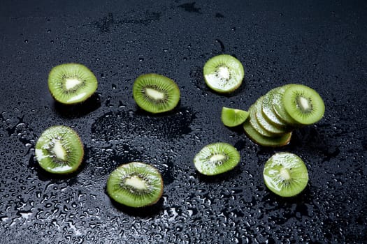 Pieces of kiwi on white background