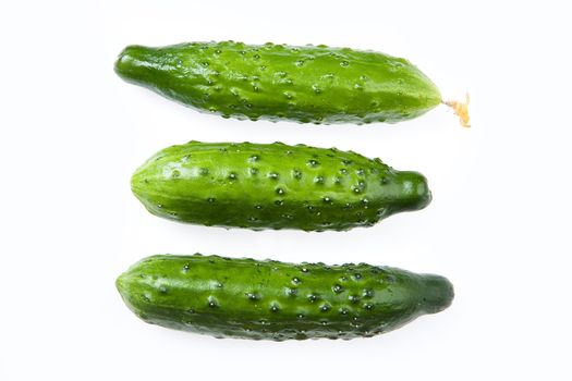 Three cucumbers on isolated background