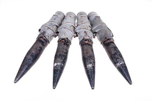 Cartridges for big caliber machinegun on isolated background