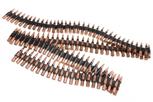 Metal belt with machinegun cartridges on isolated background