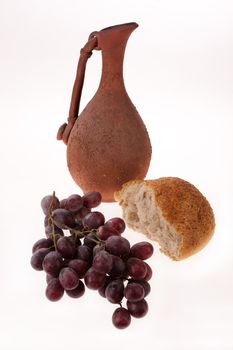 Still life with grape and ceramic jar on isolated background