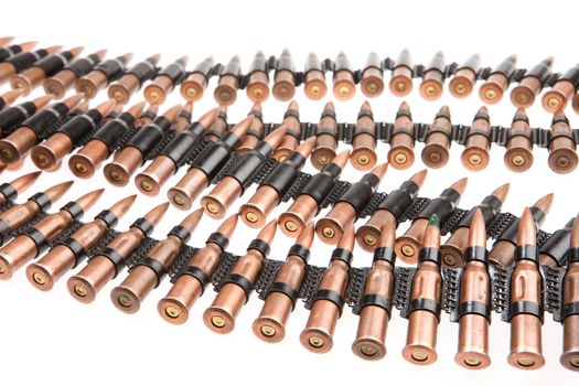 Metal belt with machinegun cartridges on isolated background
