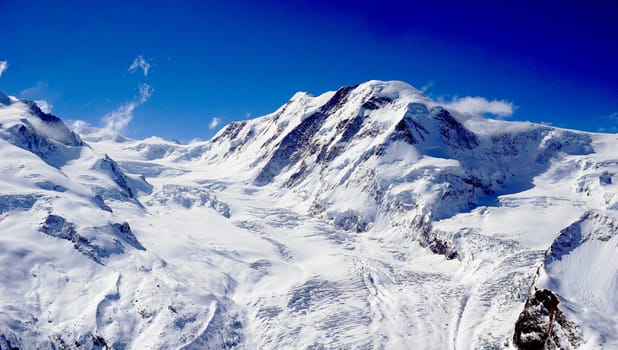 snow alps mountains and blue sky, zermatt, switzerland