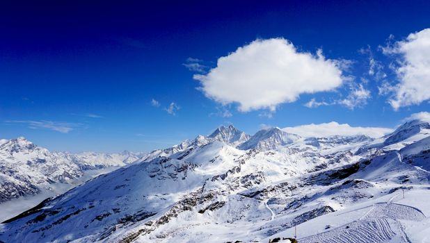 snow alps mountains horizontal and blue sky, zermatt, switzerland