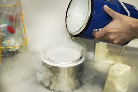 Person in a chemistry lab works with liquid nitrogen