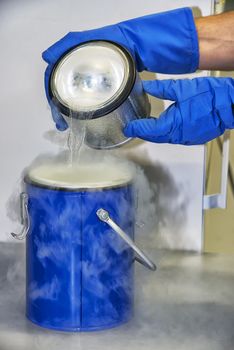 Person in a chemistry lab works with liquid nitrogen