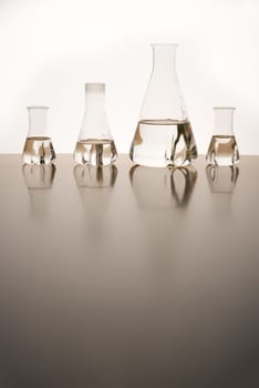 Measuring glasses on a table of a chemical laboratory and free space