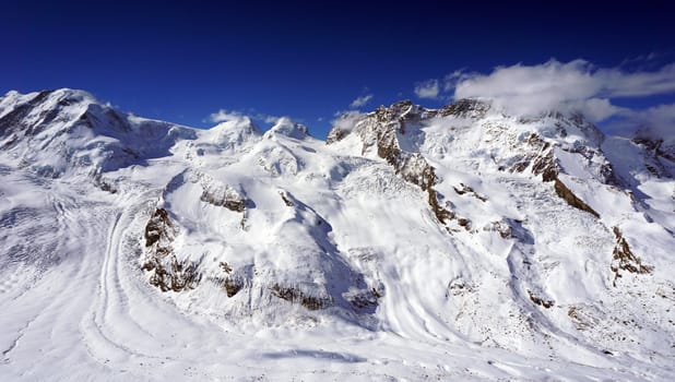 snow alps mountains view and blue sky, zermatt, switzerland