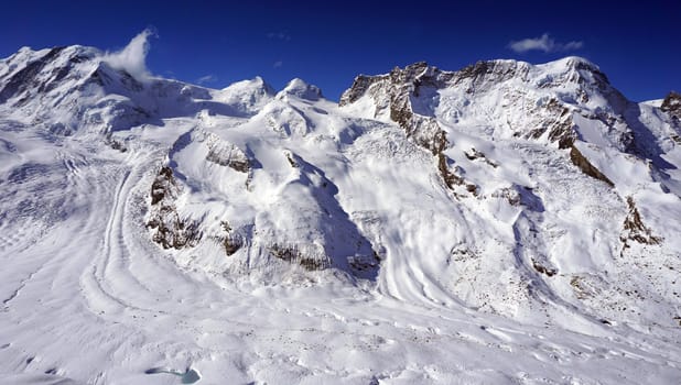 snow alps mountains and blue sky cloud, zermatt, switzerland