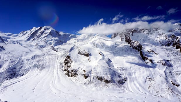 snow alps mountains view and blue sky, zermatt, switzerland