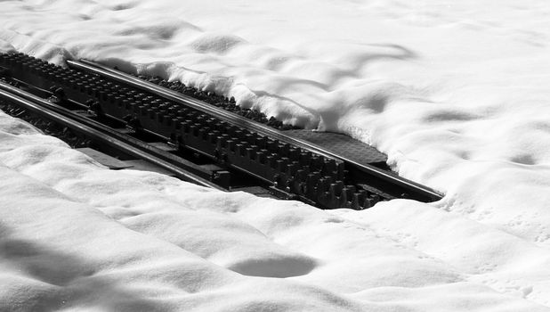 snow close up and railway track top of the mountains, zermatt, switzerland