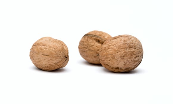 three walnuts close up isolated on white background