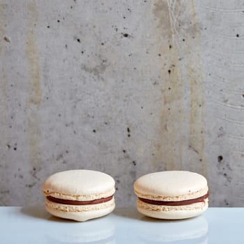 Sweet handmade macaroon on grey background. Shallow dof