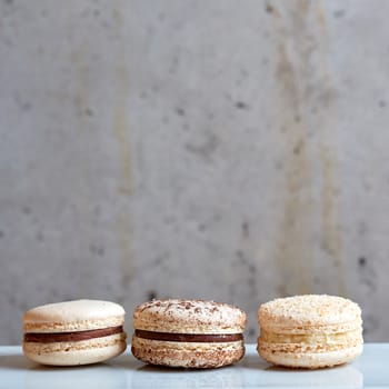 Sweet handmade macaroon on grey background. Shallow dof