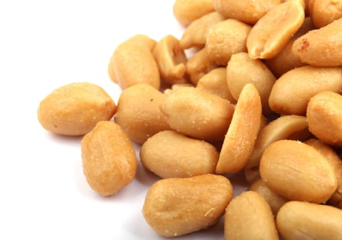 Close up of fried, peeled and salted peanuts.