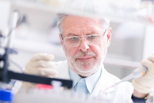 Life scientist researching in laboratory. Life sciences study living organisms on the level of microorganisms, viruses, human, animal and plant cells, genes, DNA...