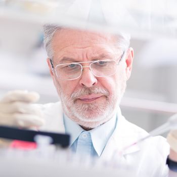 Life scientist researching in laboratory. Life sciences study living organisms on the level of microorganisms, viruses, human, animal and plant cells, genes, DNA...