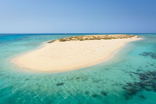 In the picture an atoll with fine white sand, turquoise sea,situated in the Red Sea in Egypt,between  the area of Hamata and Berenice.