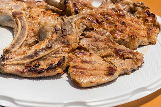 In the picture a veal cutlet just cooked on the barbecue