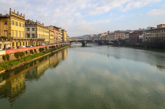 In the picture a view of Arno river with its characteristic bridges , Florence .