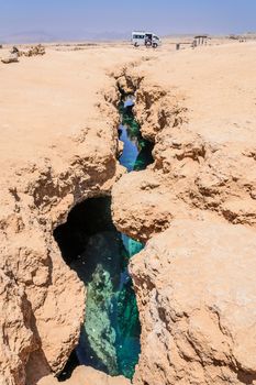 In the picture earth fracture with sea water below, situated surrounding the national park of Ras Mohammed , Egypt.