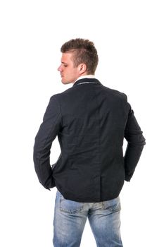 Attractive young man wearing dark jacket, white shirt and jeans standing isolated on white background