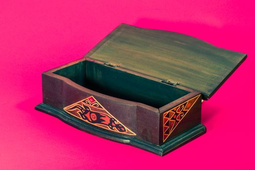 A view of open wodden carved box, vintage style.