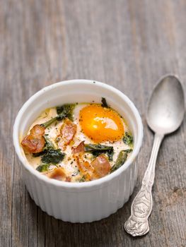 close up of rustic baked potted egg