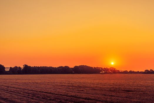 Beautiful sunrise in a countryside landscape an early morning