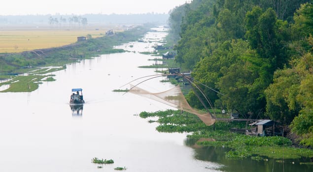 Cargo boat floating on the Mekong river, southern Vietnam.