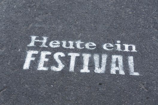 Today a festival marked on a tarmac road in blue.