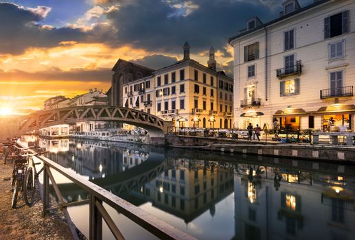 Bridge across the Naviglio Grande canal at the evening in Milan, Italy