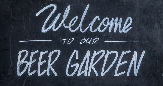 A Blackboard Sign Outside A Bar Or Pub Saying Welcome To Our Beer Garden