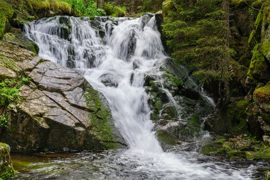 Waterfall in deep forest at mountains, Retezat national park, Romania