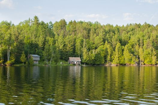 Lonely wooden cottages on a northern Ontario lake, Canada.