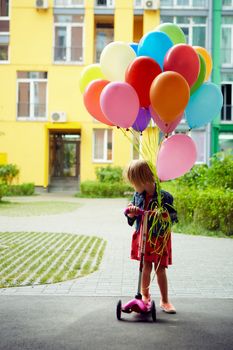 inspiration, happy little girl outdoors with balloons