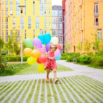 inspiration, happy little girl outdoors with balloons